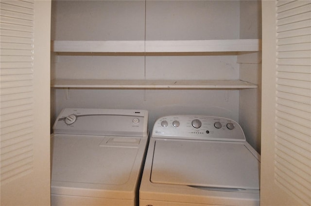 laundry room with washer and clothes dryer