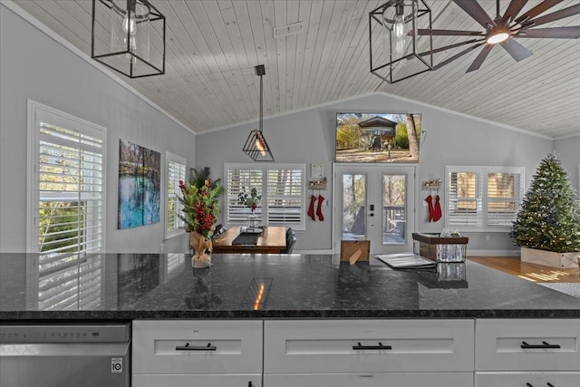 kitchen featuring wooden ceiling, white cabinetry, stainless steel dishwasher, and dark stone countertops