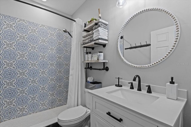 bathroom featuring a shower with shower curtain, vanity, and toilet