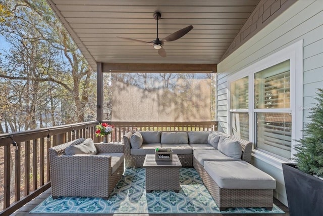 wooden terrace with outdoor lounge area and ceiling fan