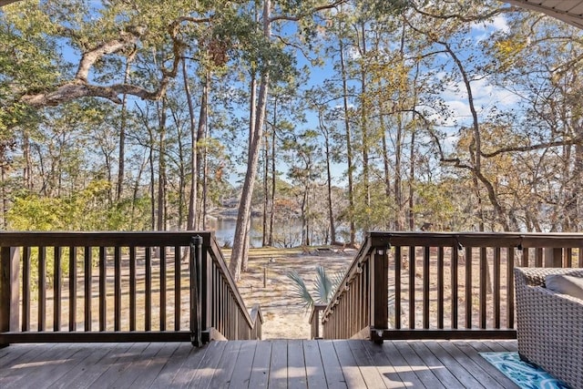 wooden deck with a water view