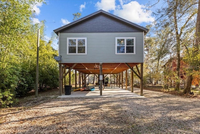 exterior space with ceiling fan