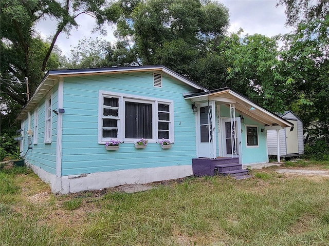 view of front of home with a front yard