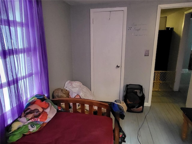 bedroom with a closet and multiple windows