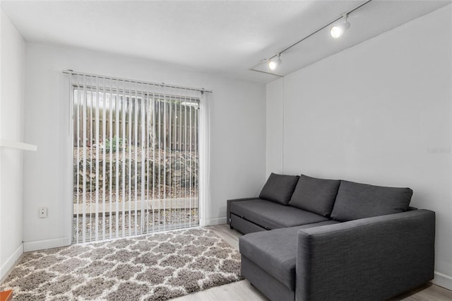 living room featuring rail lighting