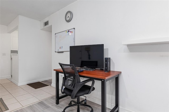 office area with light tile patterned flooring