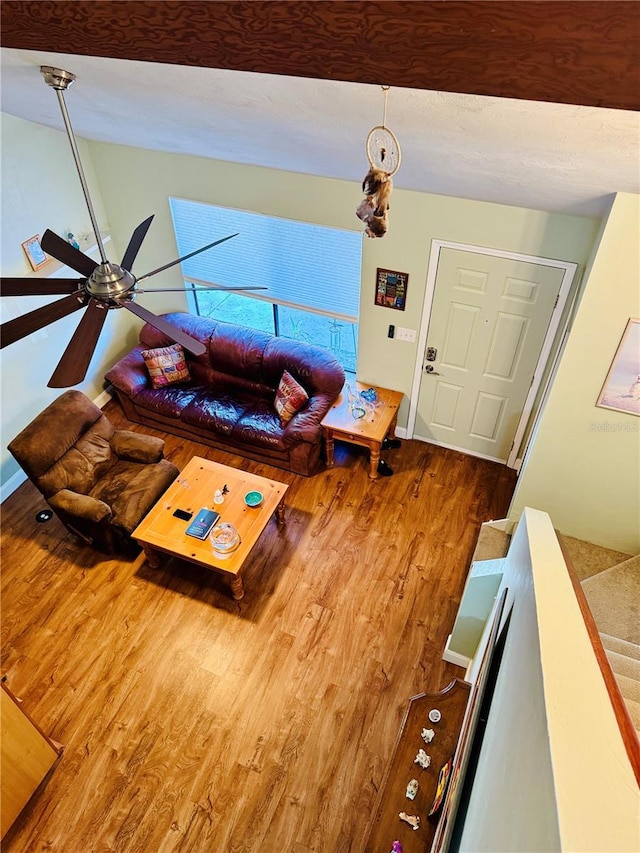 living room featuring hardwood / wood-style flooring and ceiling fan