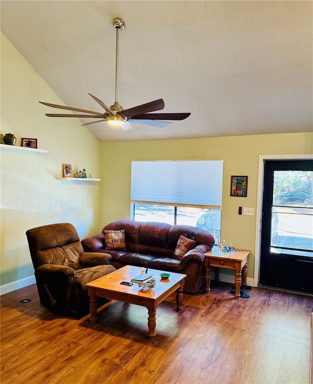 living room with wood-type flooring, ceiling fan, and vaulted ceiling