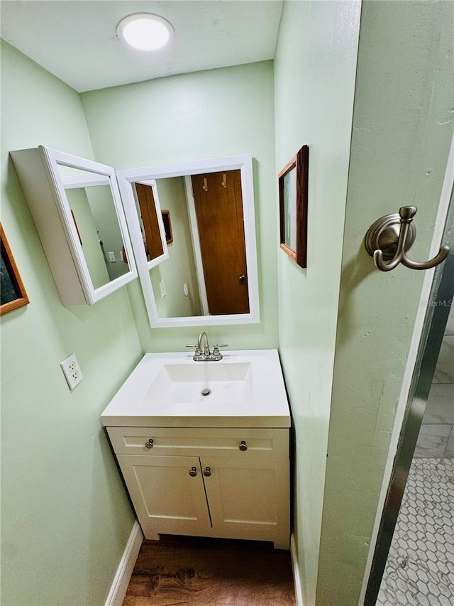 bathroom featuring vanity and wood-type flooring