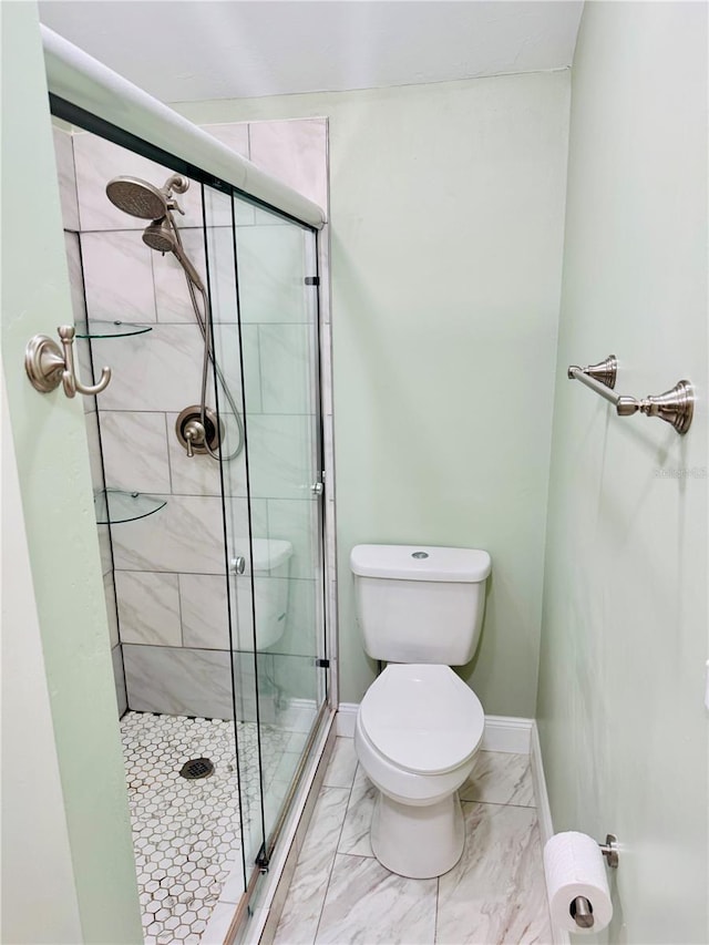 bathroom with toilet and walk in shower