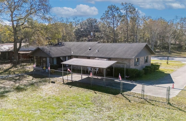 rear view of property with a yard