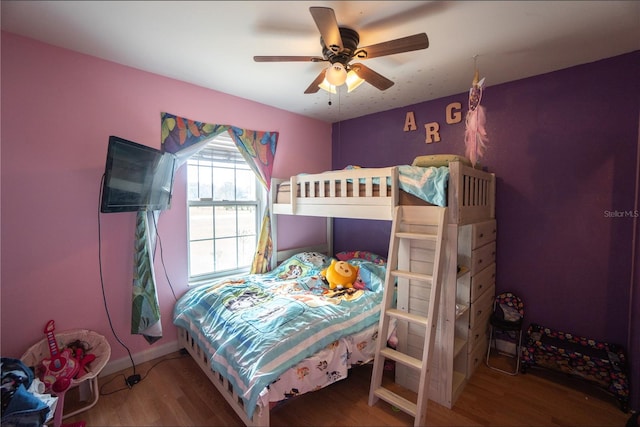 bedroom with hardwood / wood-style flooring and ceiling fan