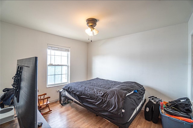 bedroom featuring wood-type flooring and ceiling fan