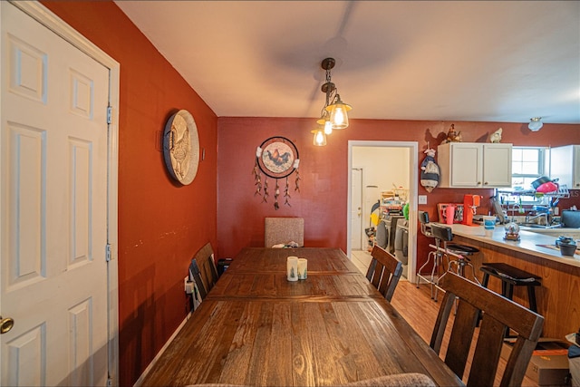 dining space with hardwood / wood-style floors