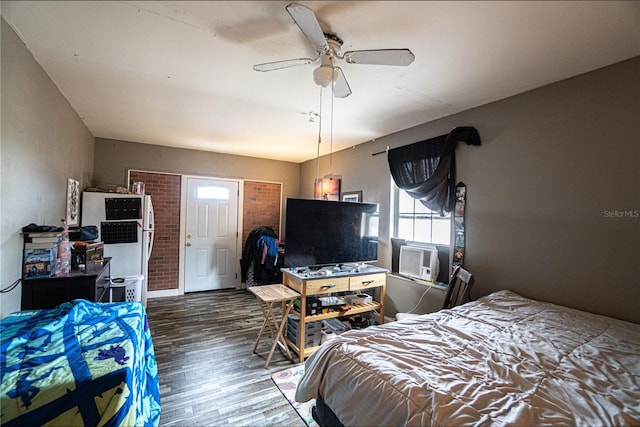 bedroom featuring ceiling fan, cooling unit, and dark wood-type flooring