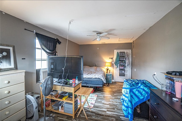 bedroom featuring hardwood / wood-style flooring, ceiling fan, and cooling unit