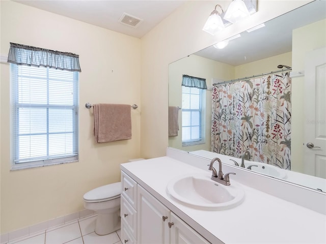 bathroom with tile patterned floors, vanity, and toilet