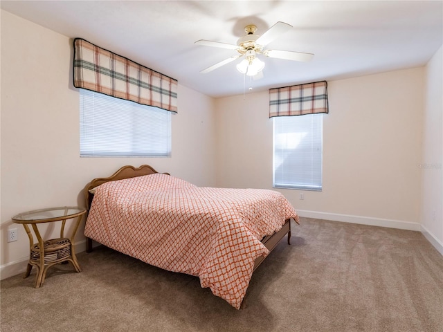 bedroom featuring ceiling fan and carpet