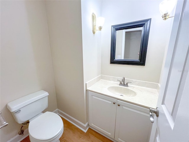 8305 SW 16th Pl, Gainesville, FL 32607 - half bathroom with vanity, toilet, and baseboards