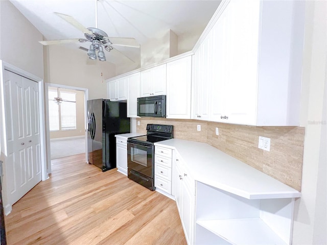 8305 SW 16th Pl, Gainesville, FL 32607 - kitchen featuring black appliances, a ceiling fan, decorative backsplash, light wood-style floors, and white cabinetry