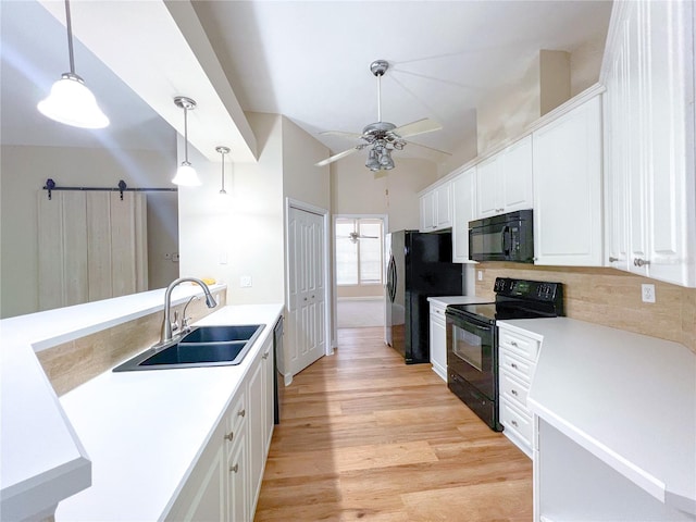 8305 SW 16th Pl, Gainesville, FL 32607 - kitchen featuring black appliances, a sink, a ceiling fan, white cabinets, and backsplash