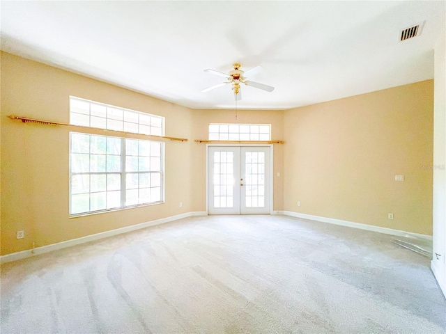 8305 SW 16th Pl, Gainesville, FL 32607 - spare room with a ceiling fan, carpet floors, baseboards, and french doors
