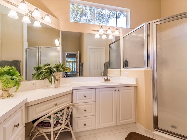 8305 SW 16th Pl, Gainesville, FL 32607 - bathroom with vanity, a shower stall, healthy amount of natural light, and tile patterned flooring