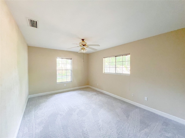 8305 SW 16th Pl, Gainesville, FL 32607 - spare room featuring carpet floors, a ceiling fan, and baseboards