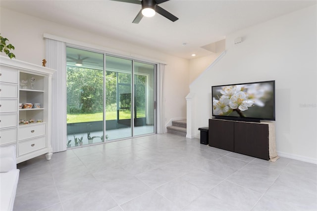 unfurnished living room featuring ceiling fan