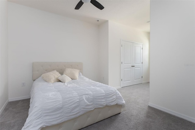 carpeted bedroom featuring ceiling fan