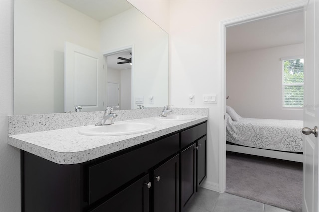 bathroom featuring tile patterned floors, ceiling fan, and vanity