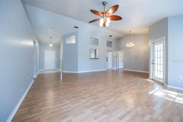 unfurnished living room with light hardwood / wood-style flooring, high vaulted ceiling, and ceiling fan with notable chandelier