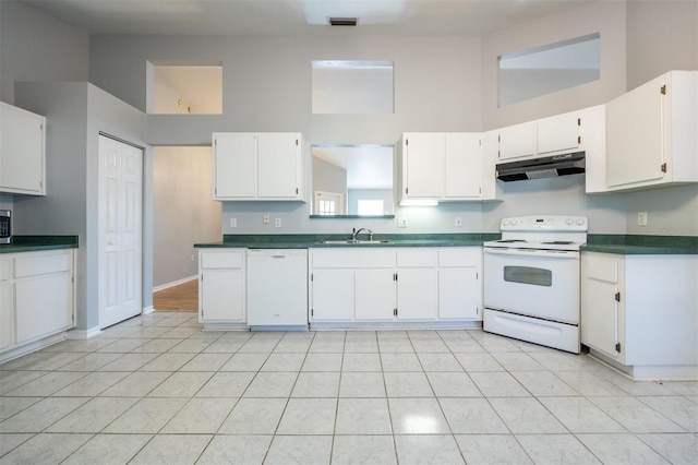 kitchen featuring white appliances, white cabinetry, and sink