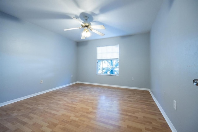 empty room with light hardwood / wood-style floors and ceiling fan