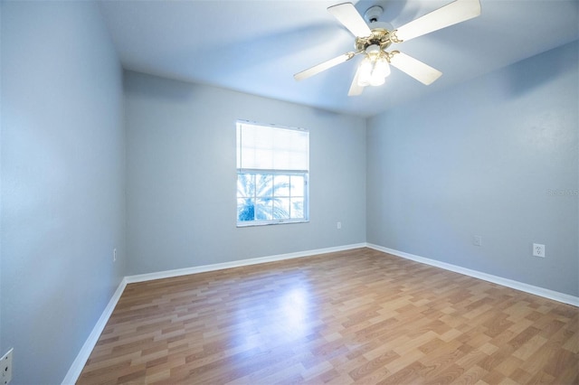 empty room featuring ceiling fan and light hardwood / wood-style floors