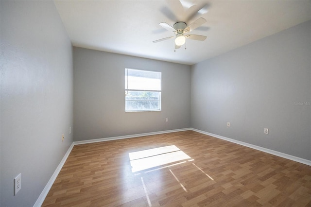 spare room with ceiling fan and hardwood / wood-style floors