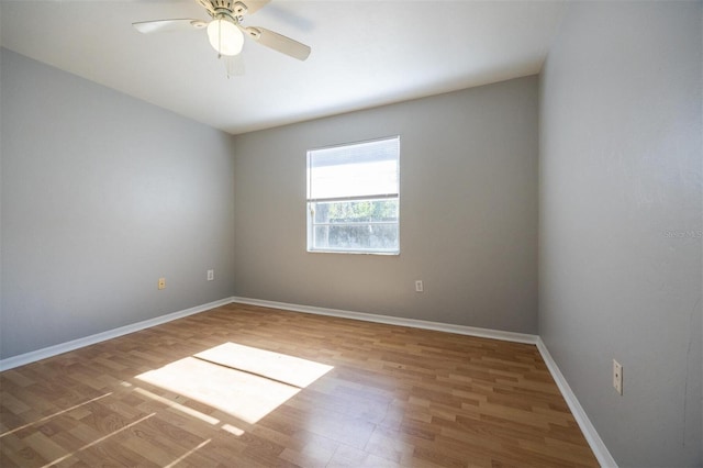 unfurnished room featuring ceiling fan and hardwood / wood-style floors