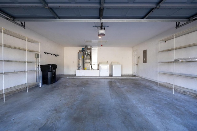 garage featuring electric panel, a garage door opener, washer and clothes dryer, and water heater