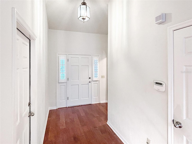 entryway with dark wood-type flooring