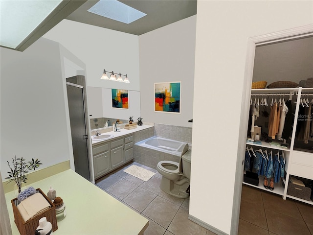 full bathroom featuring vanity, plus walk in shower, tile patterned floors, a skylight, and toilet