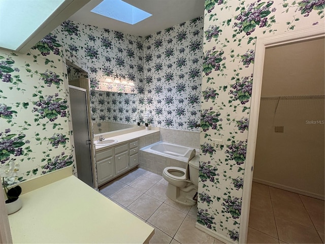 full bathroom featuring tile patterned floors, vanity, separate shower and tub, and toilet