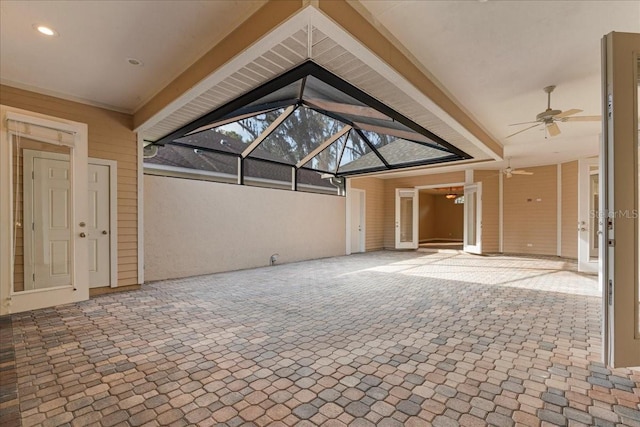 view of patio / terrace featuring a lanai and ceiling fan