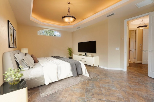 bedroom with a tray ceiling