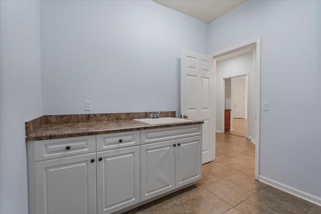 bathroom featuring tile patterned flooring and sink