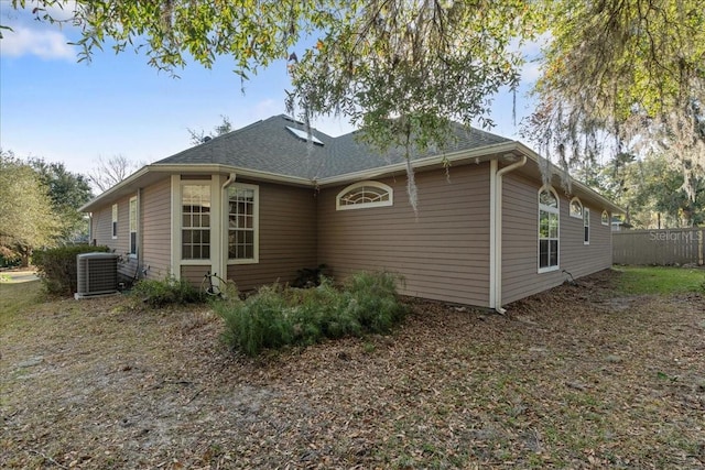 rear view of house with central air condition unit