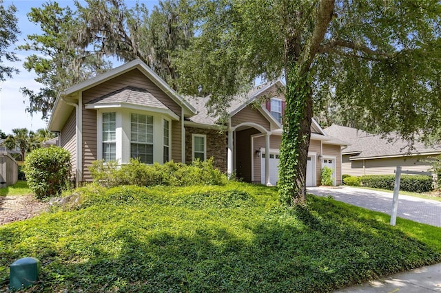 13554 NW 7th Rd, Newberry, FL 32669 - view of front of home featuring driveway and an attached garage