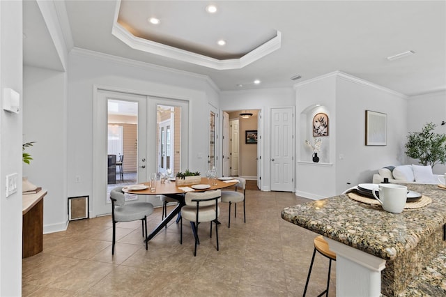 13554 NW 7th Rd, Newberry, FL 32669 - dining area with ornamental molding, french doors, recessed lighting, a raised ceiling, and light tile patterned floors