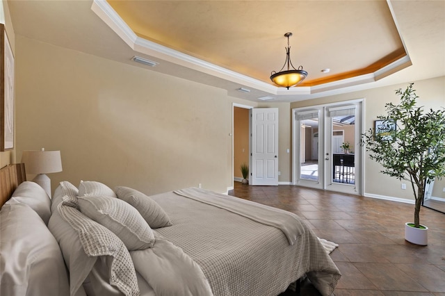 13554 NW 7th Rd, Newberry, FL 32669 - bedroom featuring a tray ceiling, access to exterior, and crown molding