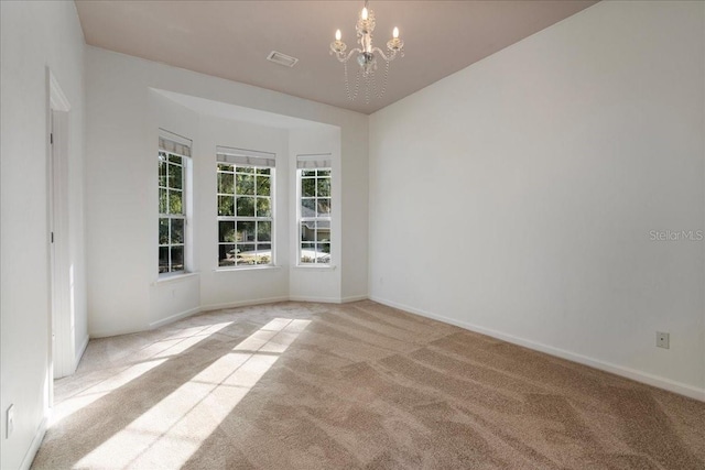 13554 NW 7th Rd, Newberry, FL 32669 - empty room with carpet floors and a chandelier