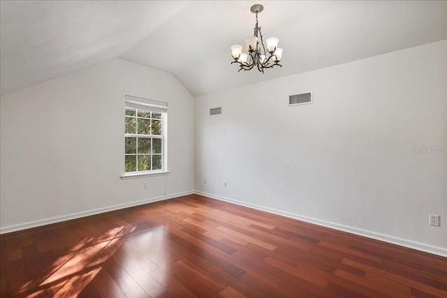 13554 NW 7th Rd, Newberry, FL 32669 - unfurnished room featuring a chandelier, wood finished floors, and vaulted ceiling